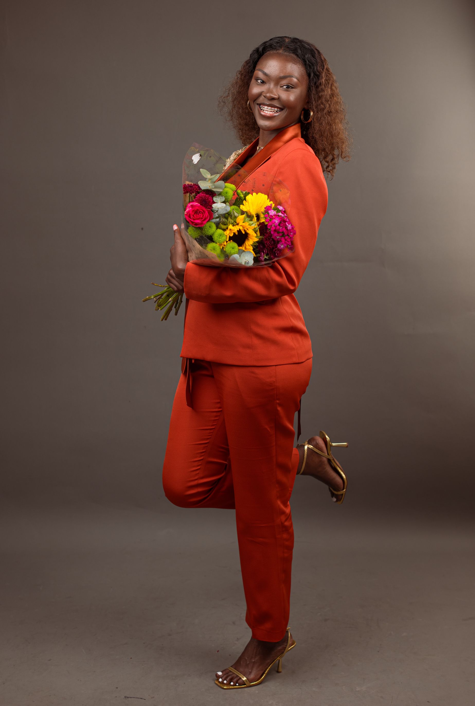 Woman Smiling with a Bouquet of Flowers · Free Stock Photo