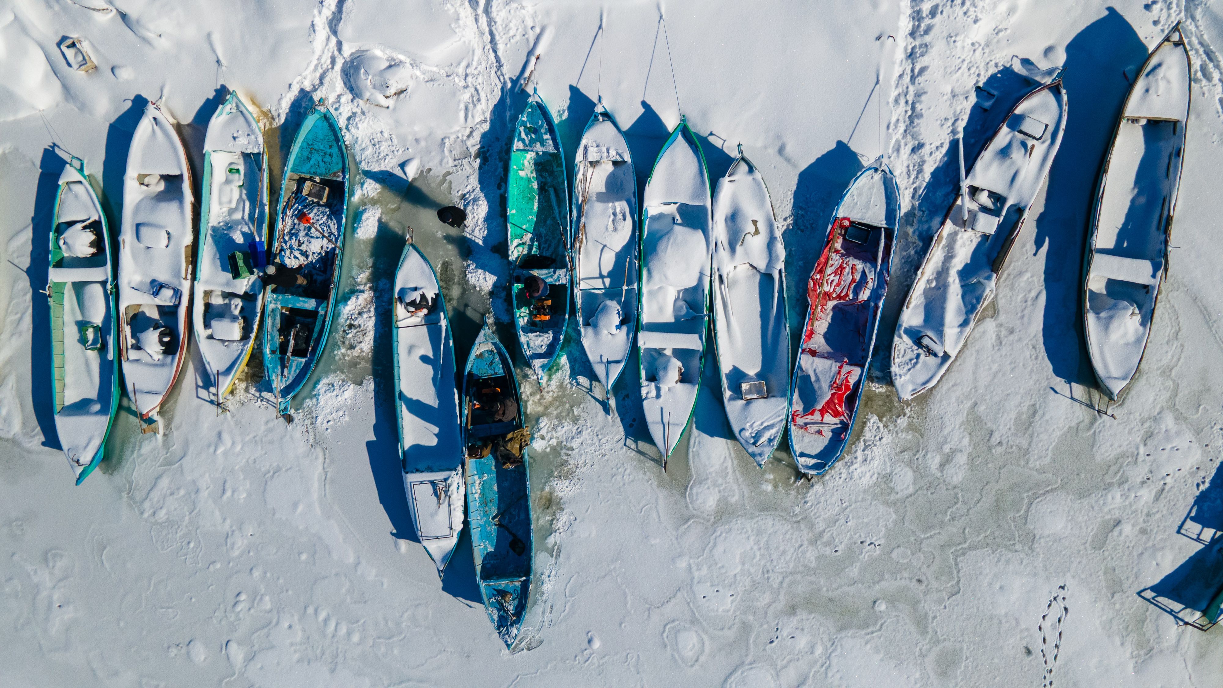 Aerial View of Boats on Snowy Shore in Winter · Free Stock Photo