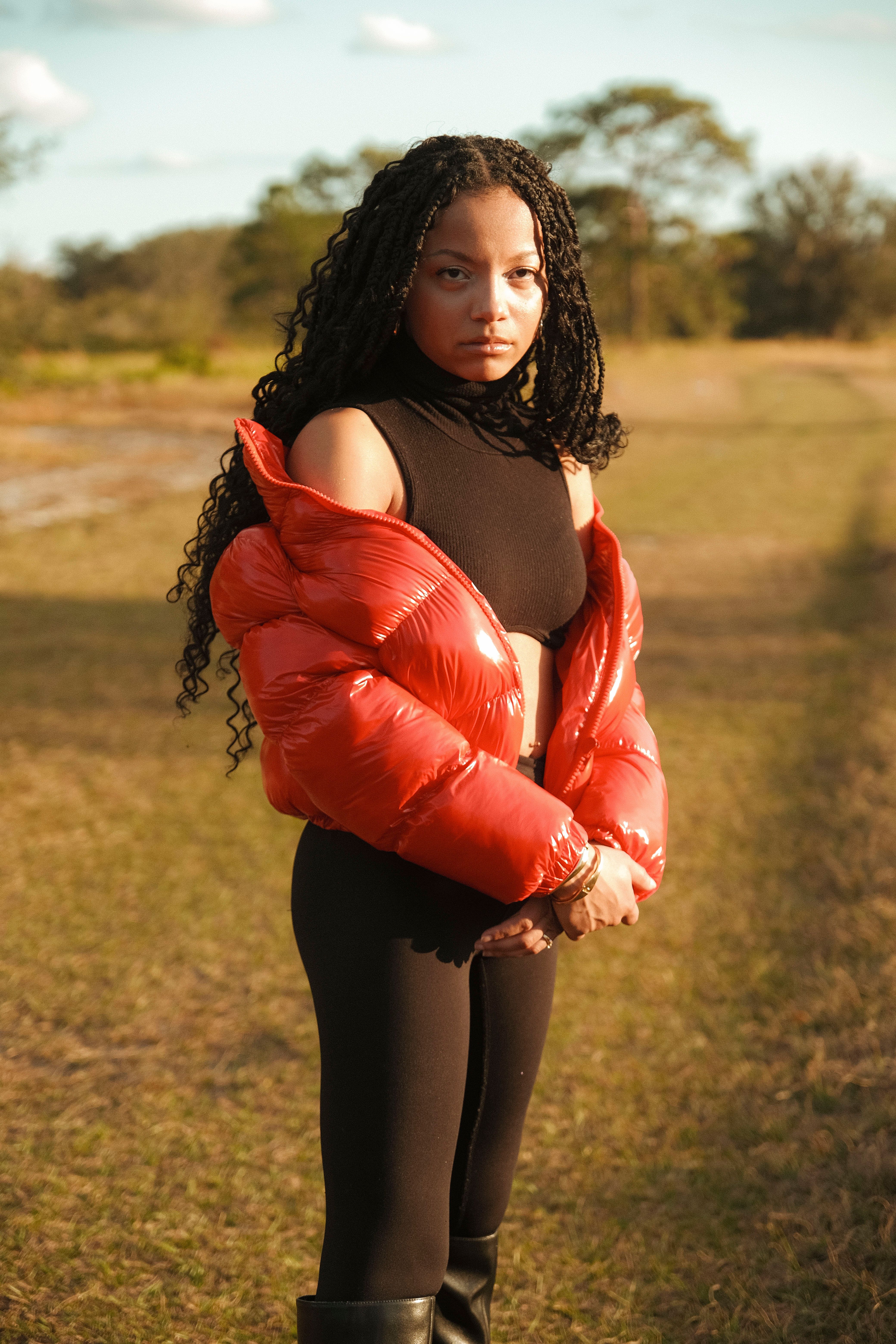 Woman in a red quilted puffer jacket outdoors in winter street style