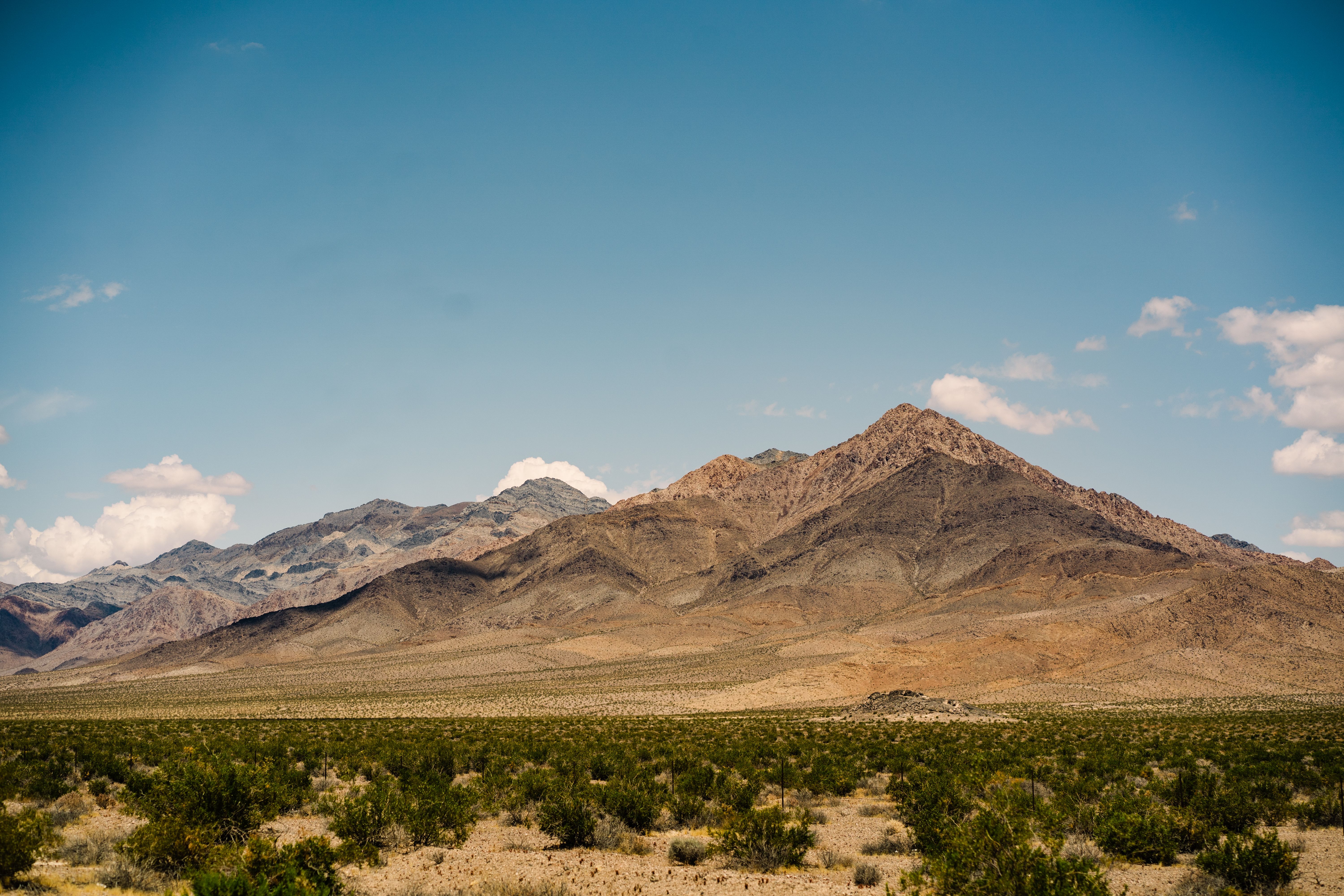 Beautiful landscape of the Mojave Desert mountains under a clear blue sky in California.