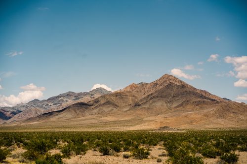 Free Beautiful landscape of the Mojave Desert mountains under a clear blue sky in California. Stock Photo