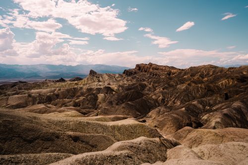 Free Explore the breathtaking barren landscape of Death Valley, California, with its rugged desert terrain and vast skies. Stock Photo