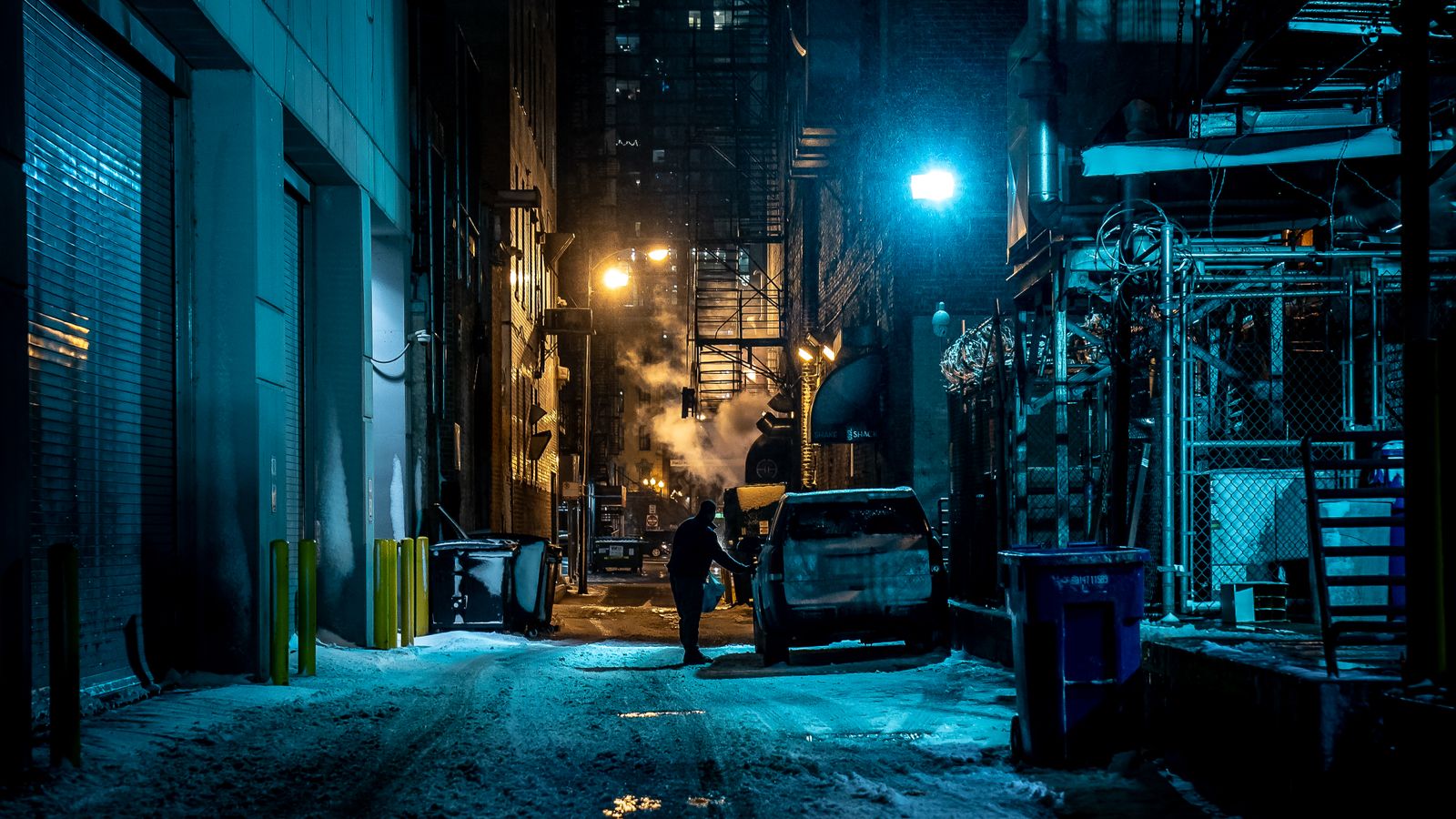 A moody alleyway at night in a big city, a real stock photo chosen for the dark, shadowy city feel that critics describe in Clayface's Gotham. It is not a still from the movie and it does not show anyone from the cast