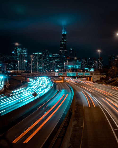 Free Vibrant Chicago night scene with bright city lights and dynamic traffic trails. Stock Photo