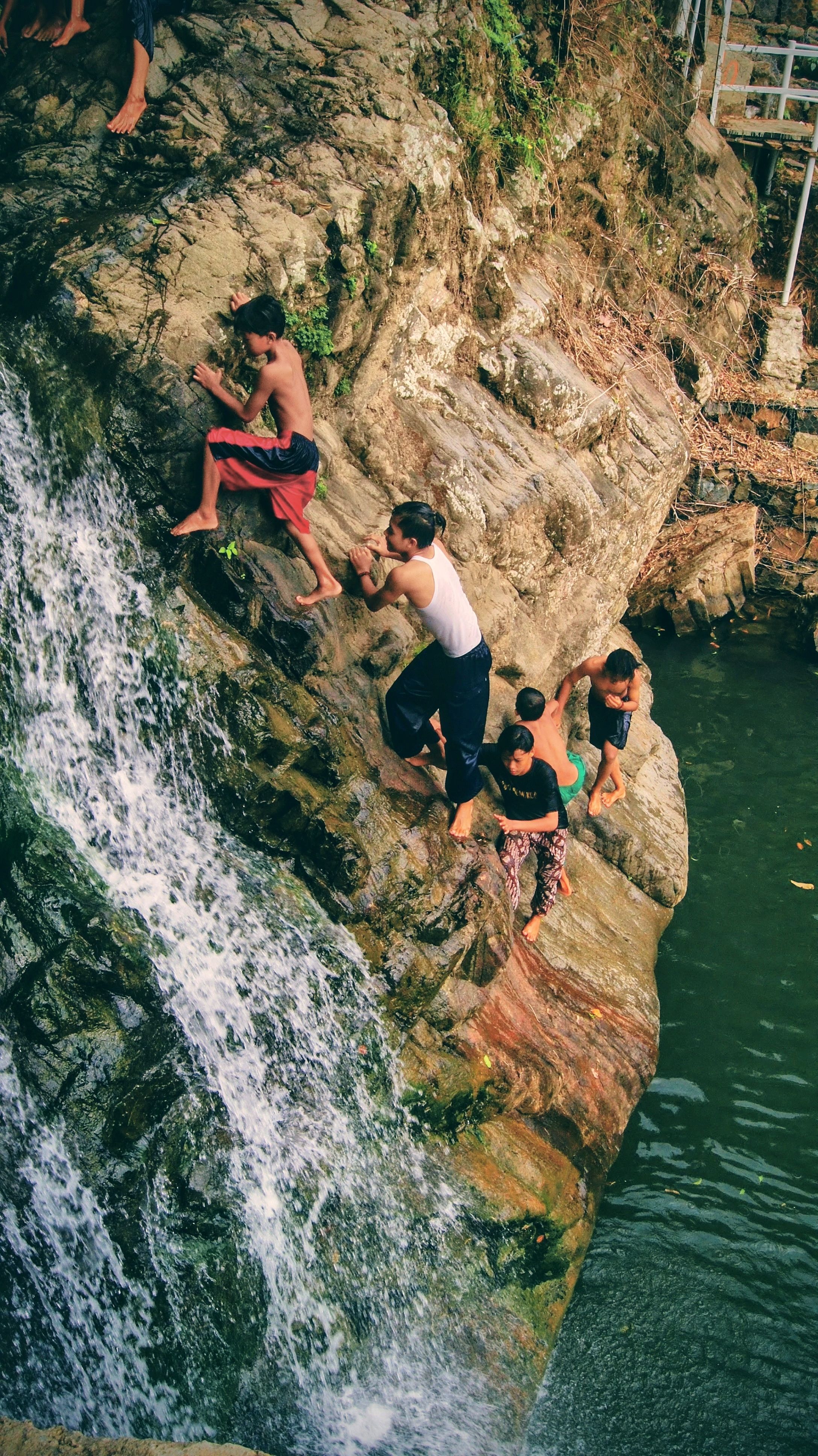 Group Exploring Scenic Waterfall in Nature · Free Stock Photo