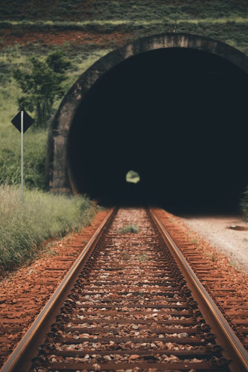 Free Photo of Railroad Track Across Tunnel Stock Photo