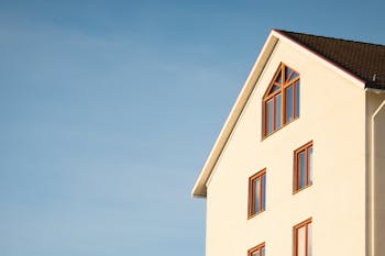 Beige Concrete House Under Cumulus Cloud