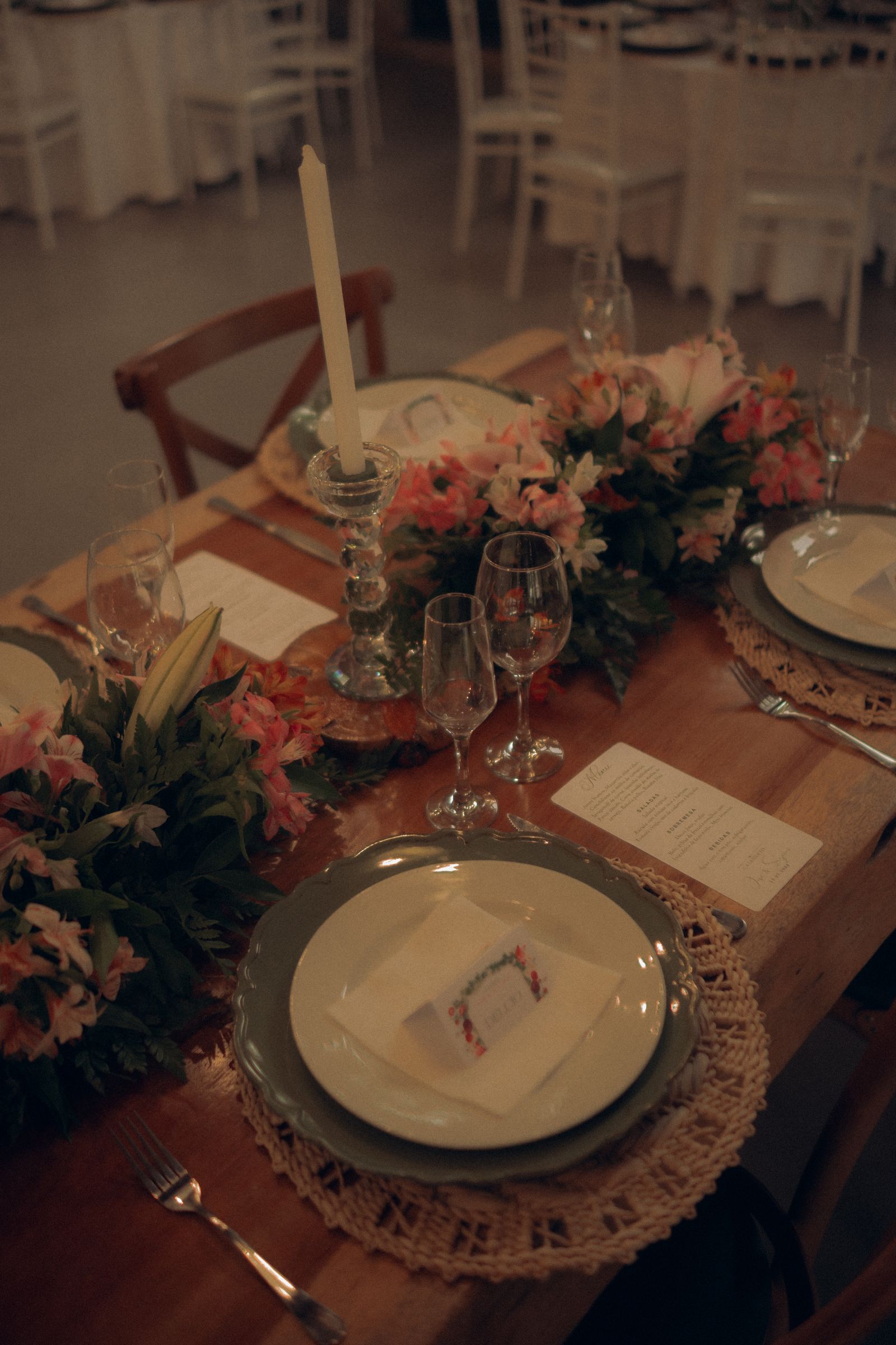 Elegant wedding reception table with floral centerpiece and place settings