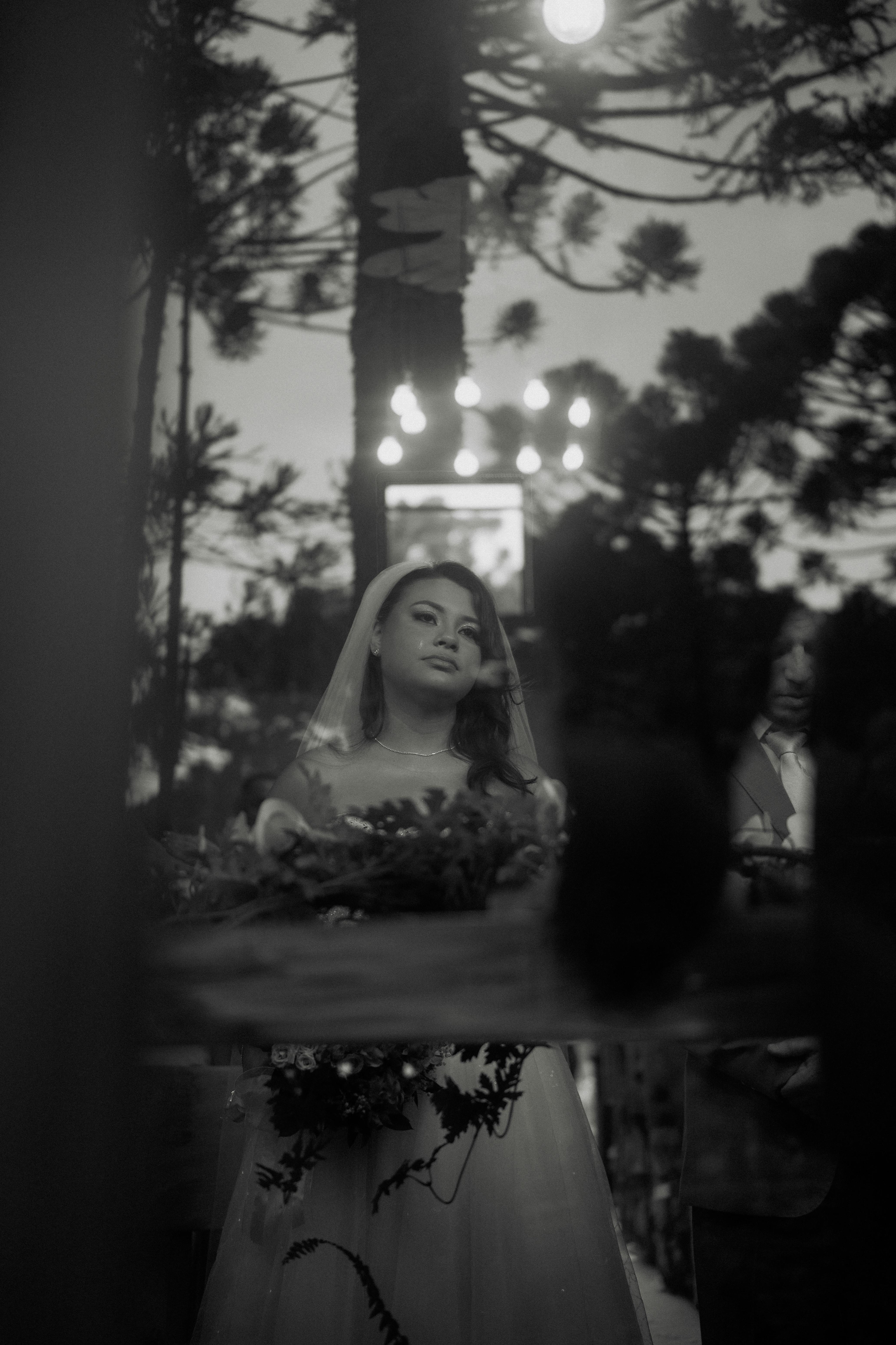 Bride and groom captured in a serene outdoor wedding scene.