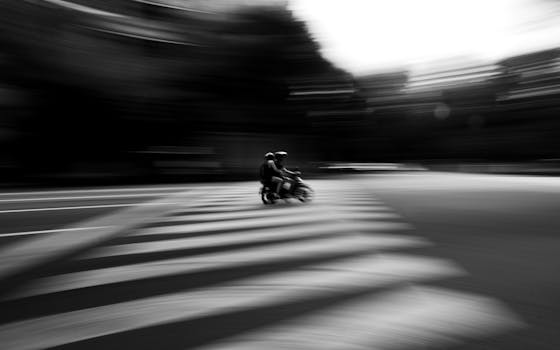 Artistic black and white motion blur of a motorbike crossing in Buenos Aires.