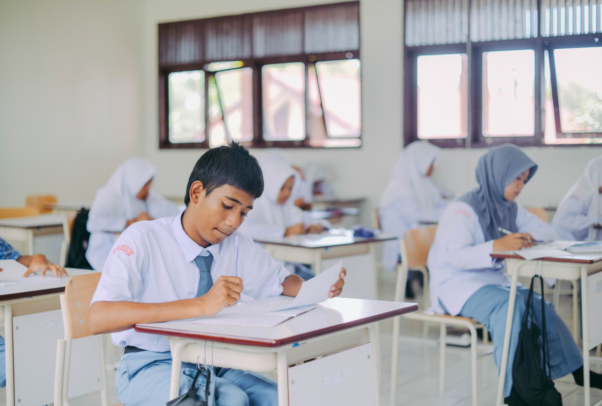 High school students in Indonesia studying in a classroom setting.