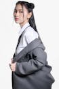 Fashion Portrait of Stylish Asian Woman in Grey Suit