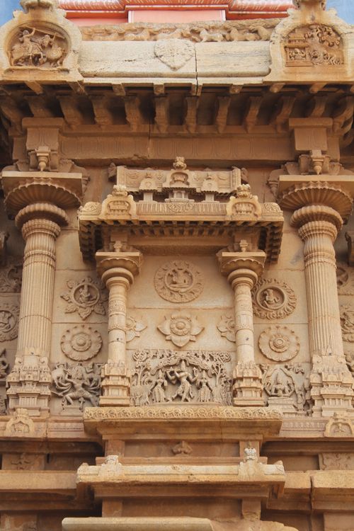 Free Detailed stone carvings depicting historical scenes on an ancient temple facade. Stock Photo