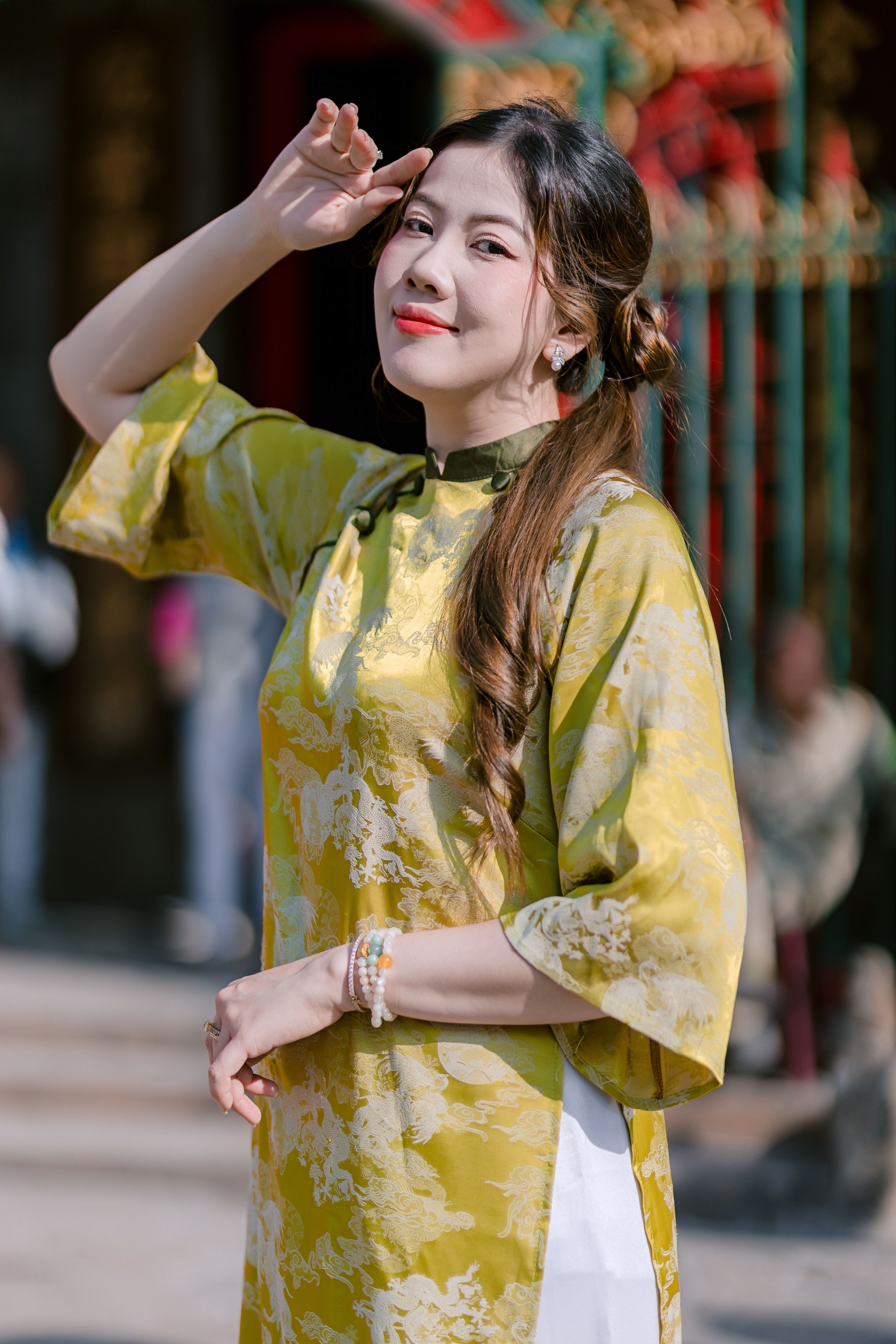 Woman in Traditional Yellow Asian Dress Outdoors · Free Stock Photo
