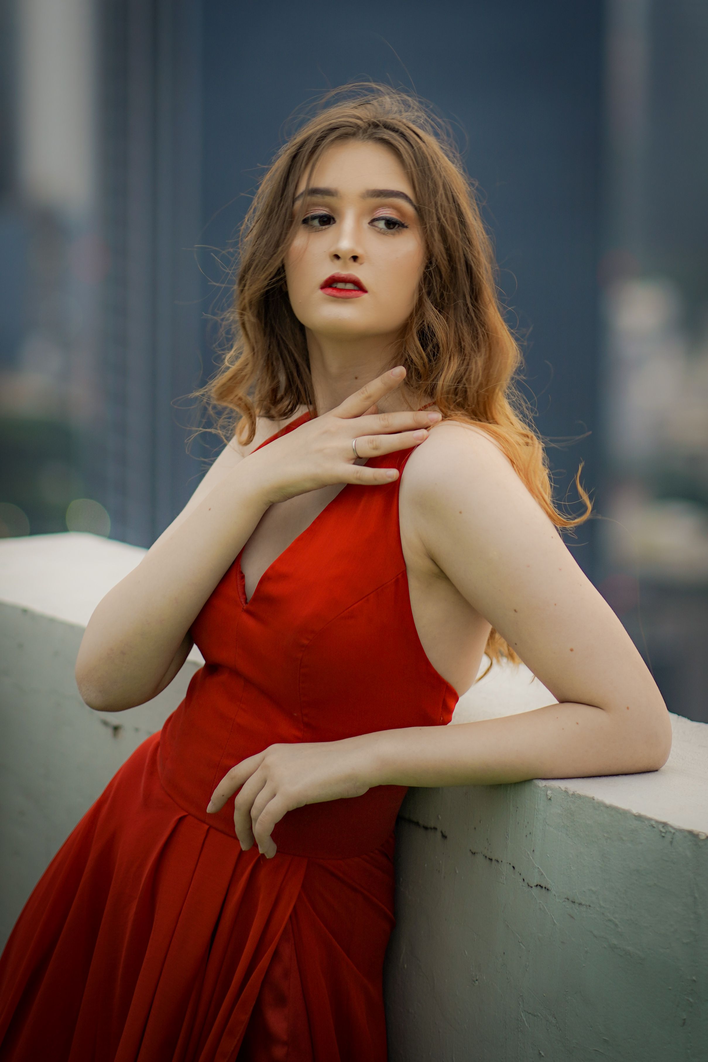Elegant Woman in Red Dress Posing Outdoors · Free Stock Photo