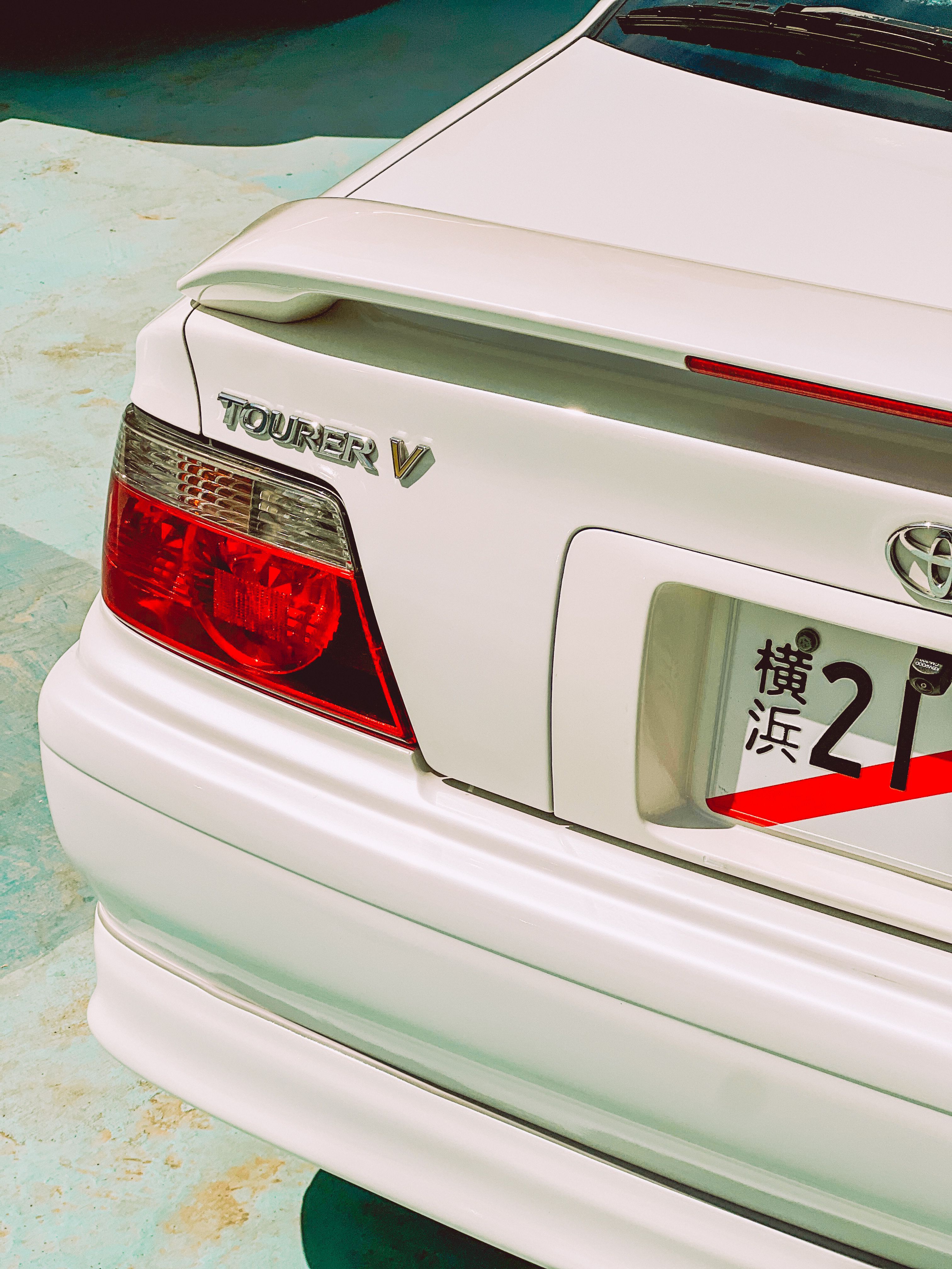 White Car Rear View with Japanese License Plate · Free Stock Photo