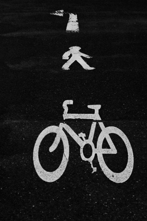 Free Artistic black and white photo showing road signage for bicycle and pedestrian path. Stock Photo