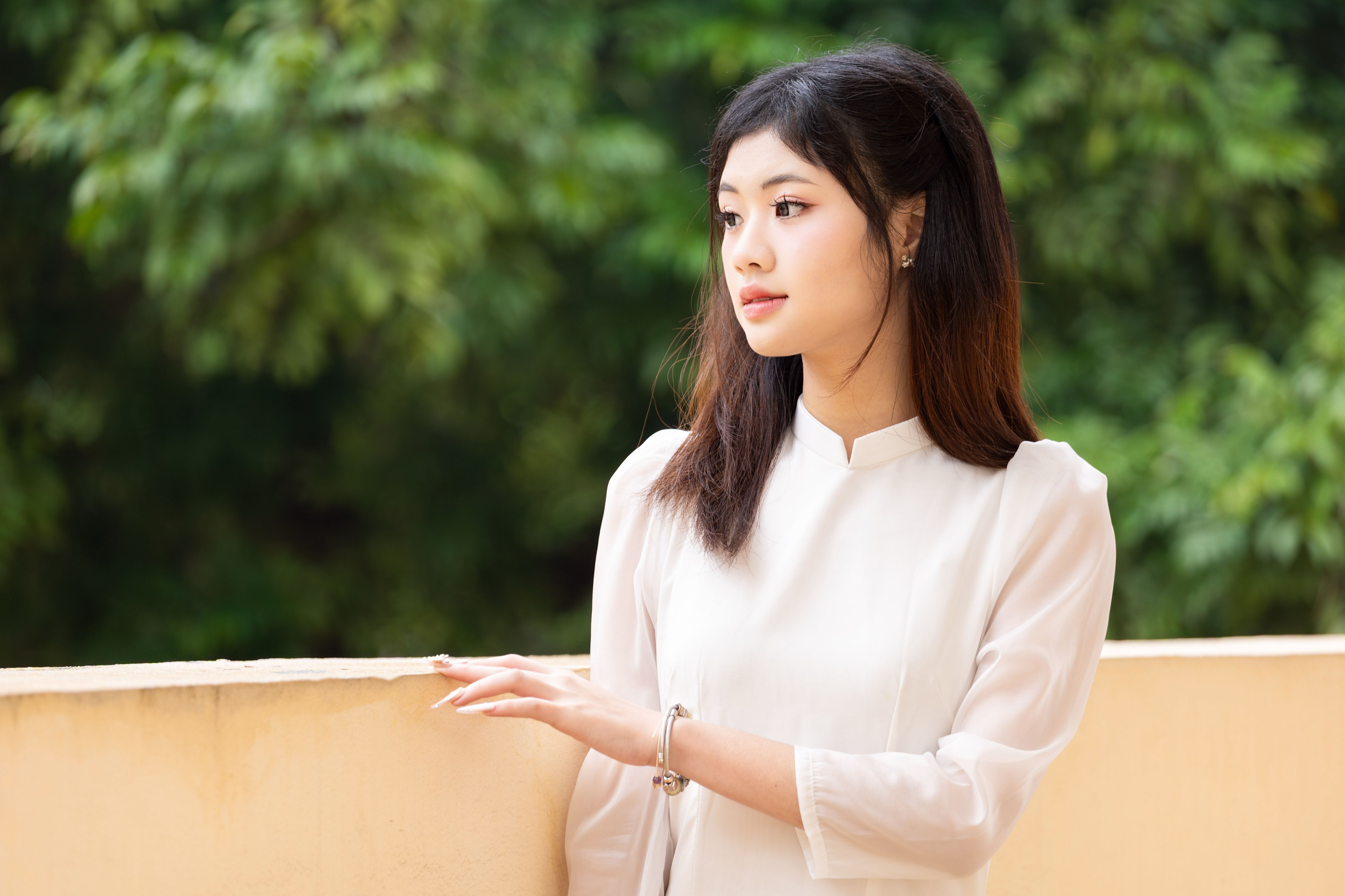 Young Woman in Traditional White Dress Outdoors · Free Stock Photo