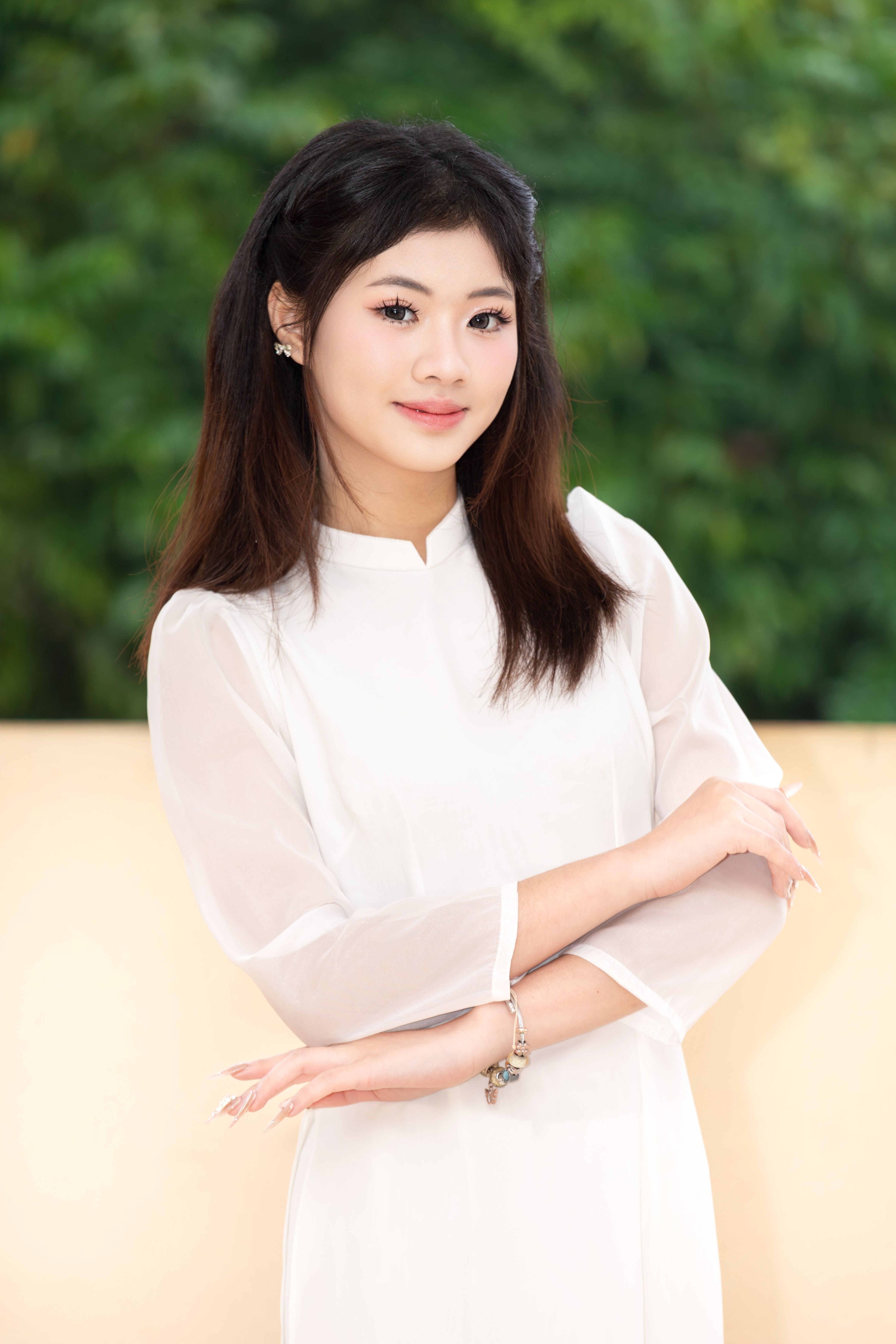 Portrait of a woman in a white Ao Dai, representing Vietnamese culture and elegance.