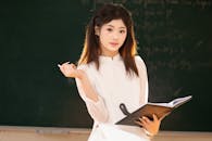 Young Woman Studying in Vietnamese Classroom