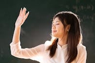 Young woman enjoying sunlight in Hà Nội classroom