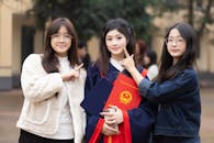 Three Friends Celebrating Graduation in Hanoi