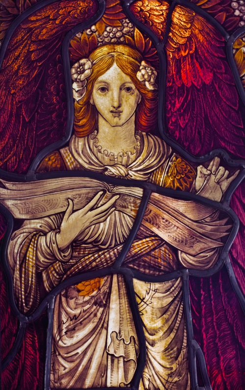 Free Traditional stained glass depicting an angel with intricate detail and vibrant colors. Stock Photo