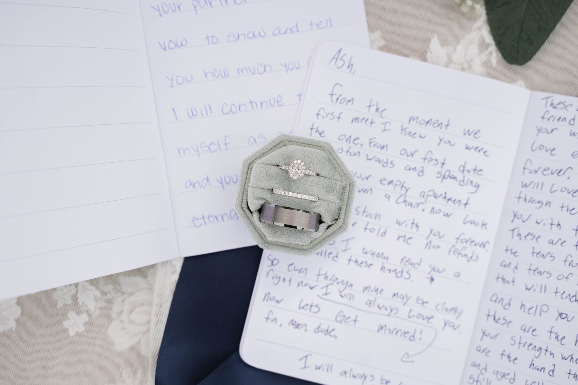 A romantic display of wedding vows, featuring handwritten notes and a beautiful ring set.