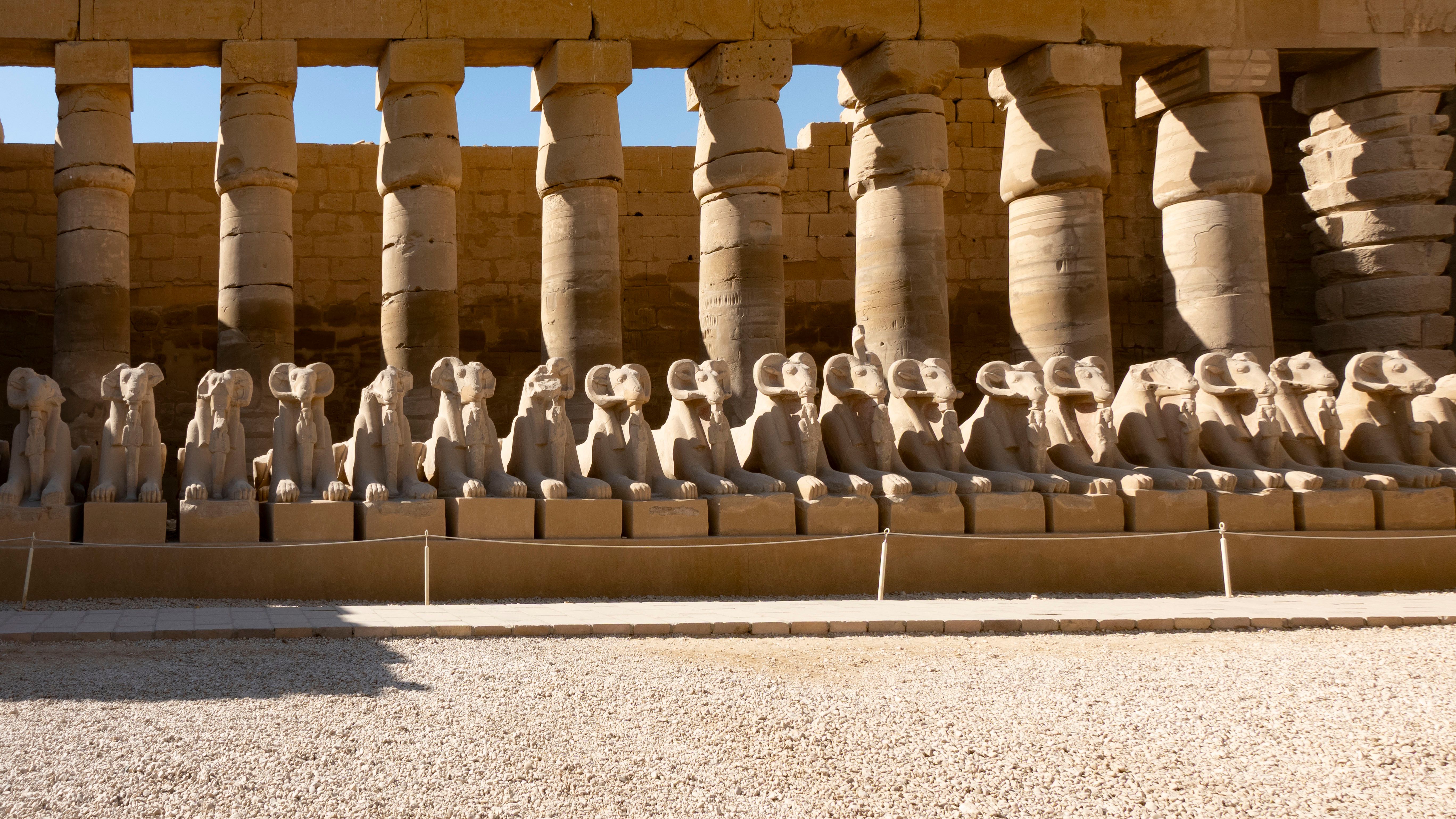 Ram-headed sphinx statues lining the processional way at Karnak Temple Complex, Luxor, Egypt