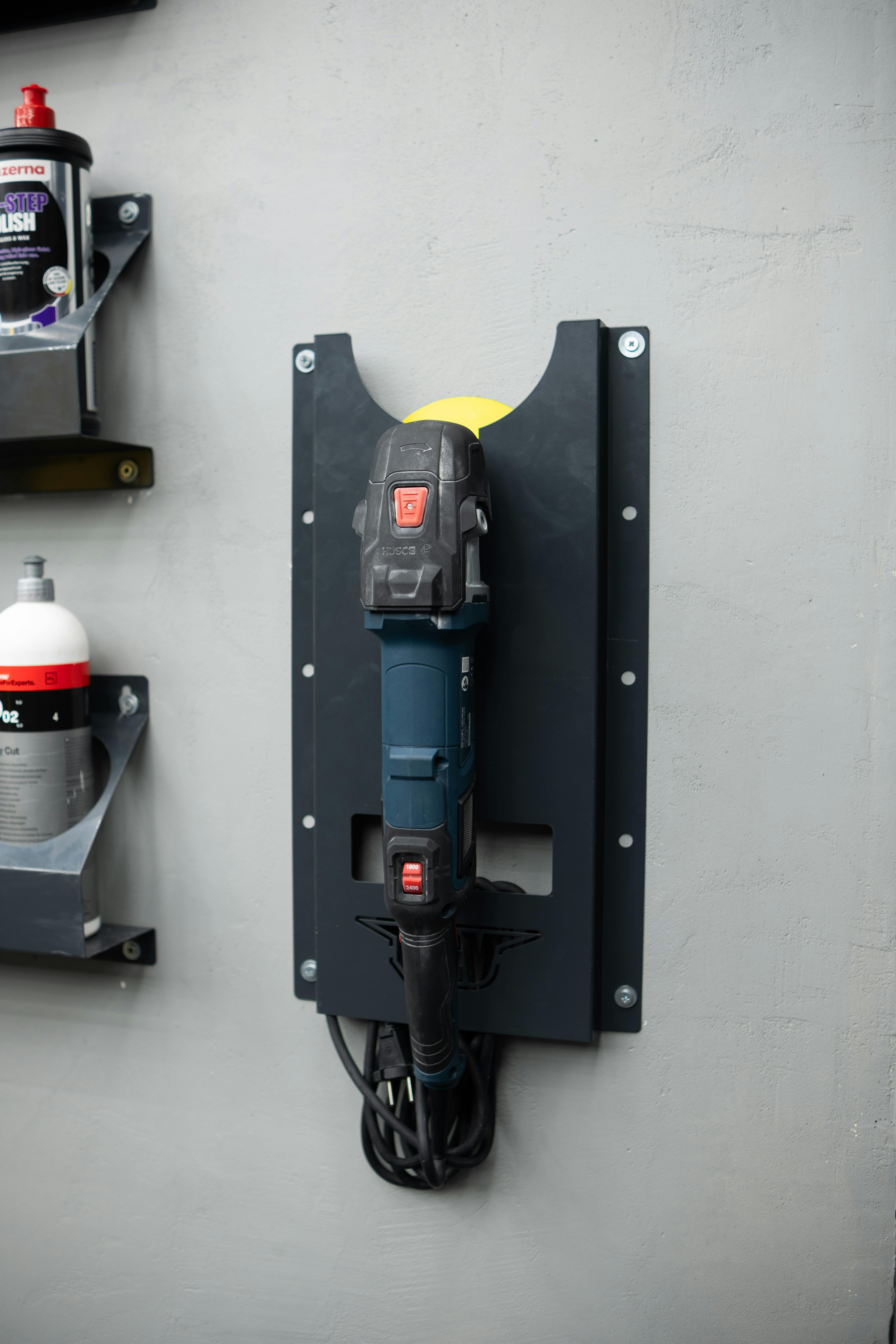 Wall-mounted power tool storage in workshop