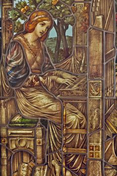 Beautiful stained glass depicting a woman playing an organ, featuring intricate Art Nouveau designs.. pexels, beautiful, stai