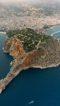 Stunning aerial shot of Alanya's rocky peninsula jutting into the sea in Turkey.