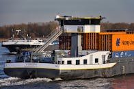 Cargo Ship on River with Containers