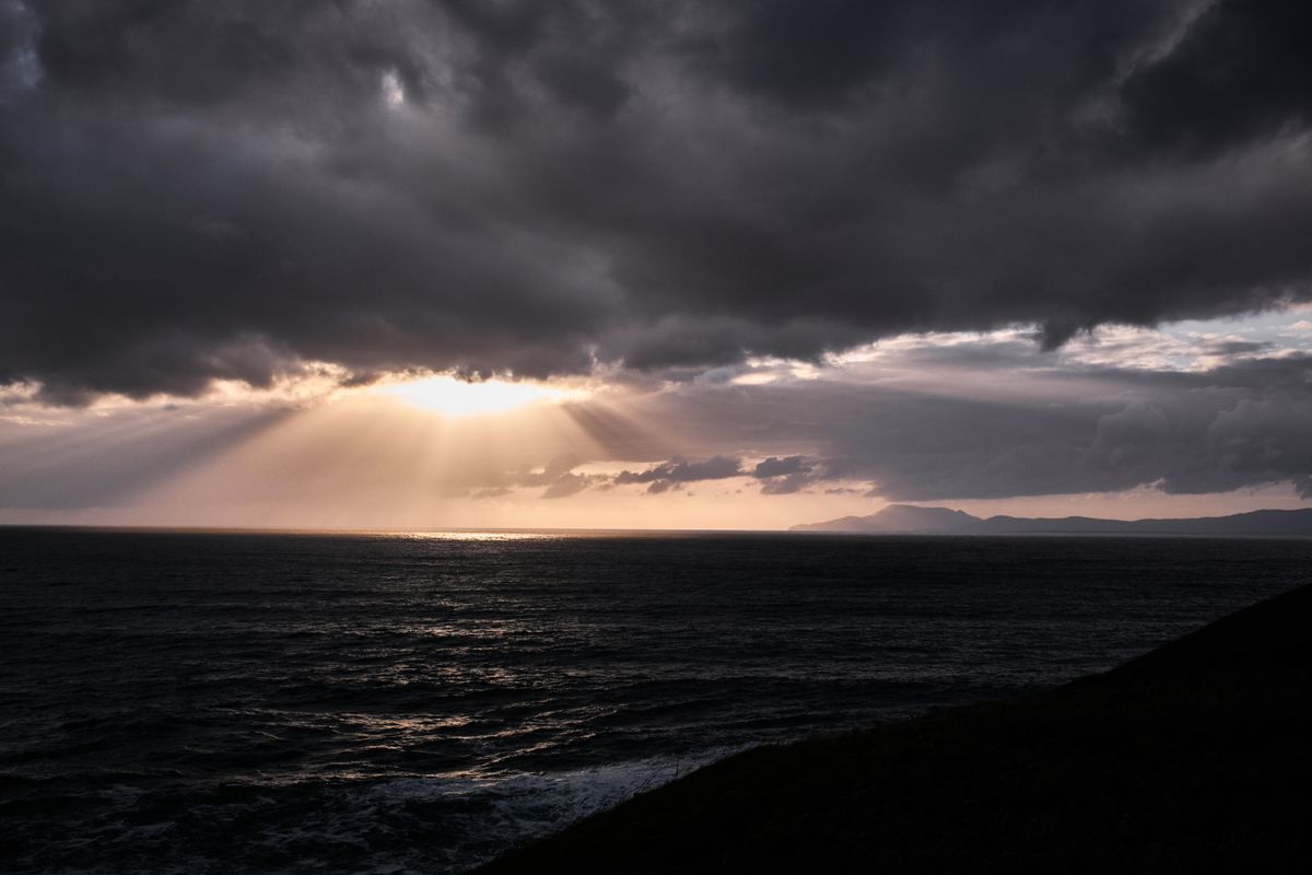 Sunbeams breaking over the Donegal coastline