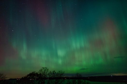 Stunning Northern Lights display over Reads Landing, Minnesota at night.