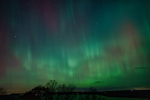 Free Stunning Northern Lights display over Reads Landing, Minnesota at night. Stock Photo