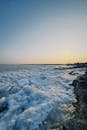 Sunset Over Frozen Shoreline in Konaev, Kazakhstan