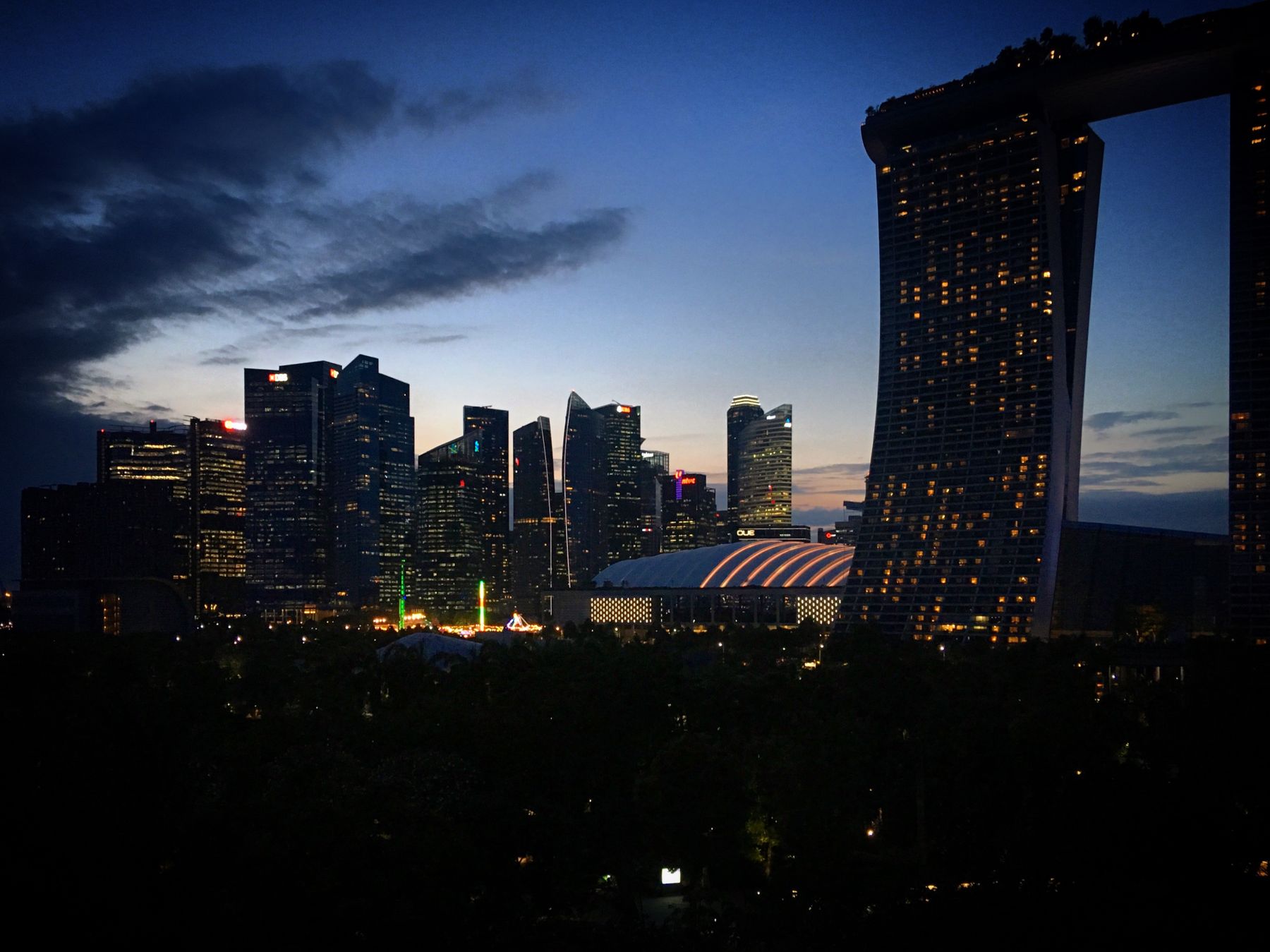 Singapore's illuminated Marina Bay skyline at twilight