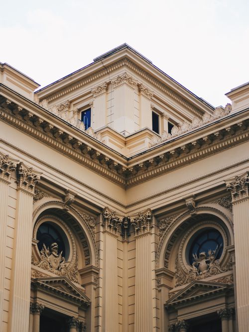 Free Detailed view of neoclassical building facade, featuring ornate columns and intricate carvings. Stock Photo