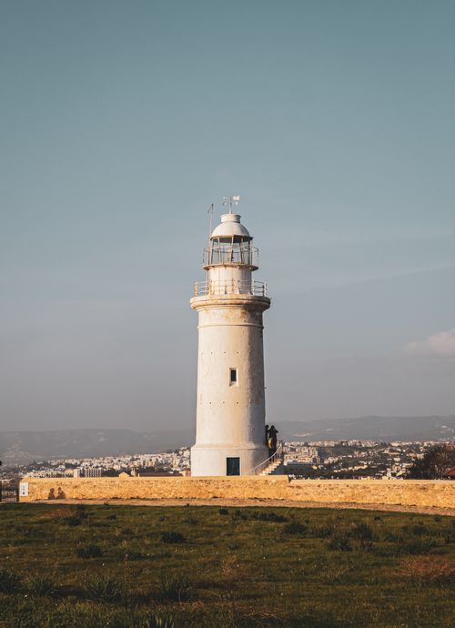 Free Scenic view of the iconic Paphos Lighthouse in Cyprus, captured during the day against a clear blue sky. Stock Photo