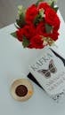 Flat Lay of Book, Coffee, and Red Roses
