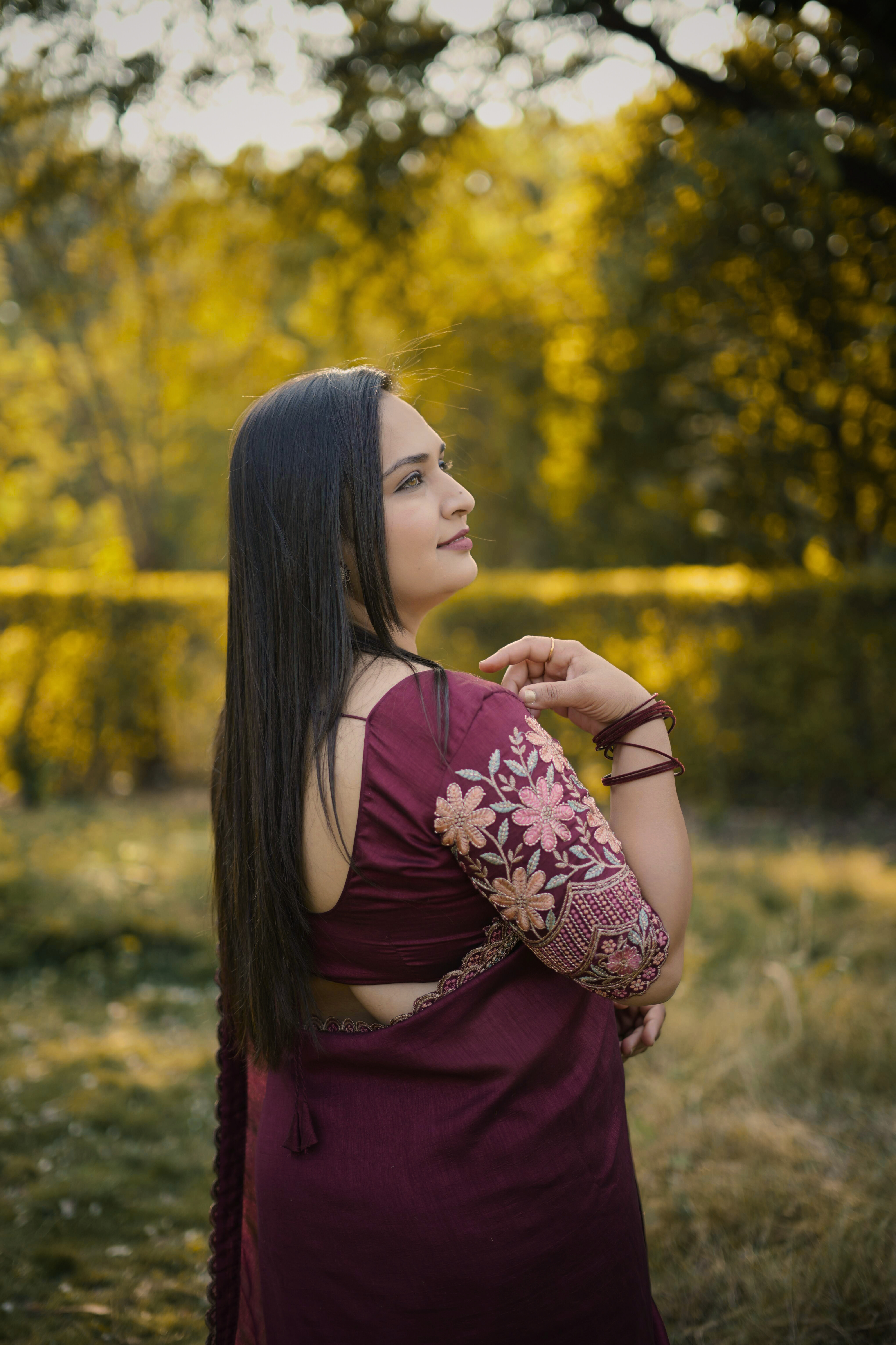 Elegant Woman in Saree Posing Outdoors · Free Stock Photo