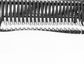 Snow-Covered Metal Bench in Winter Park