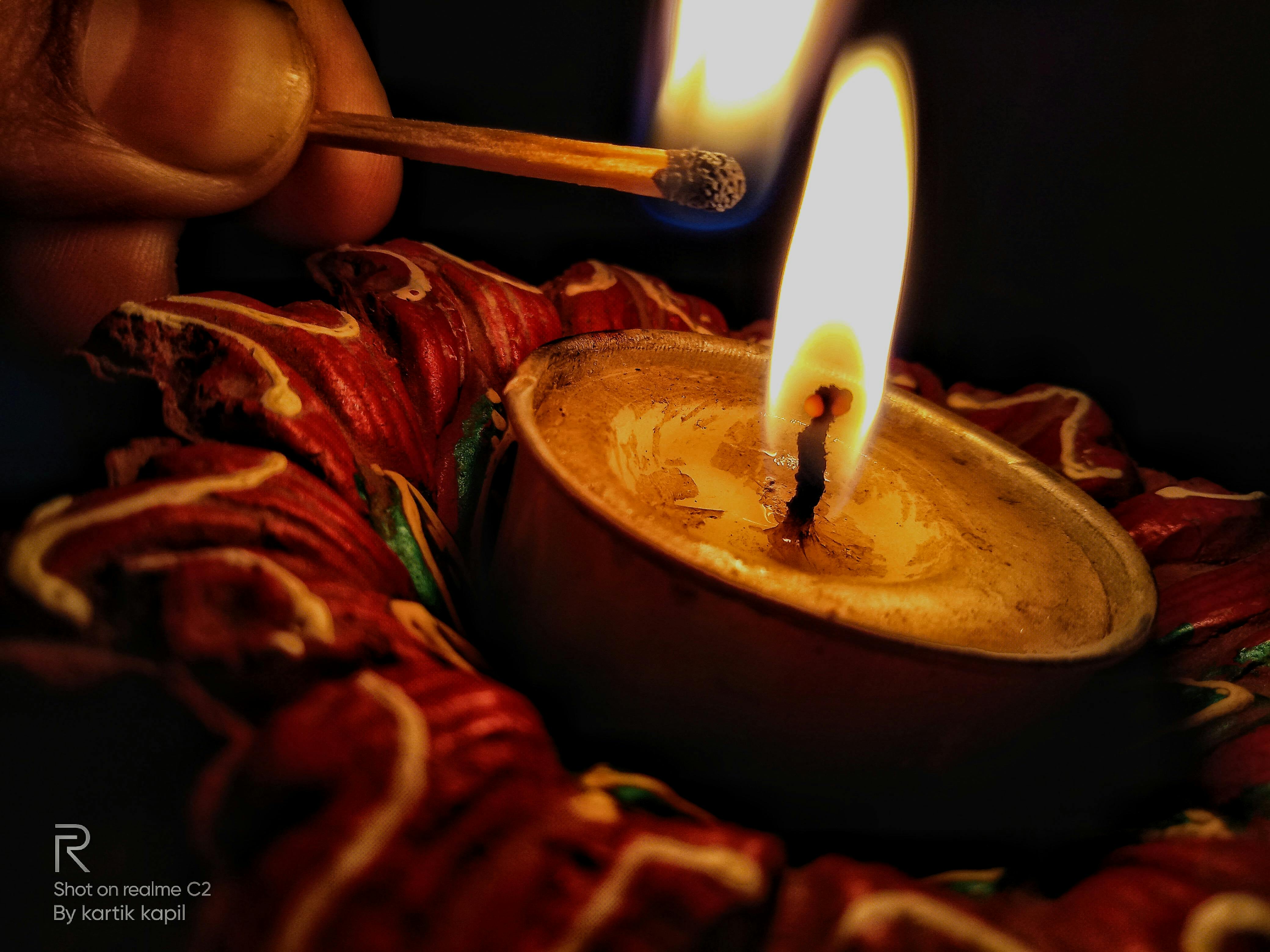 Audience at a concert holding up phones and recording