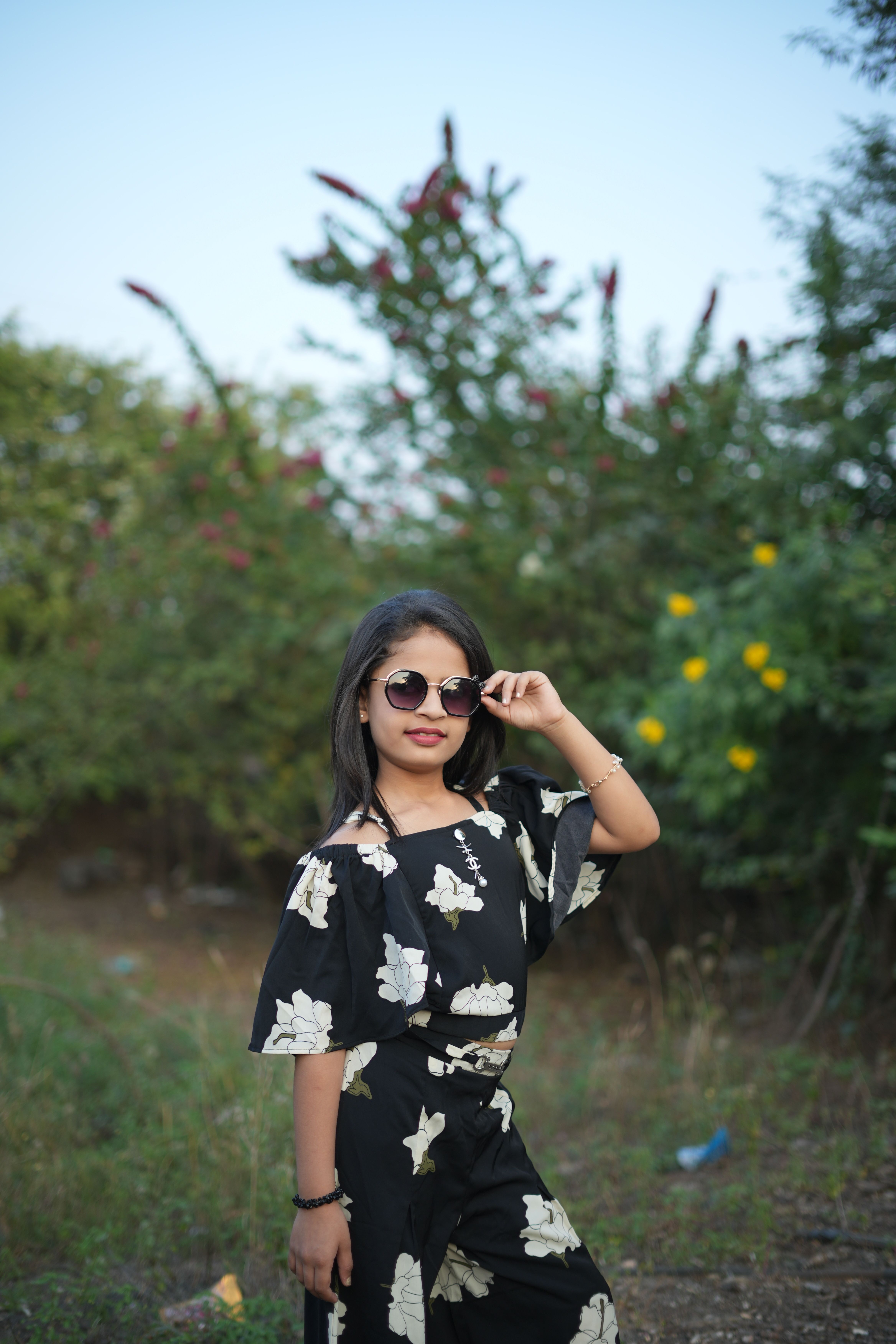 Young Girl in Floral Dress Outdoors · Free Stock Photo