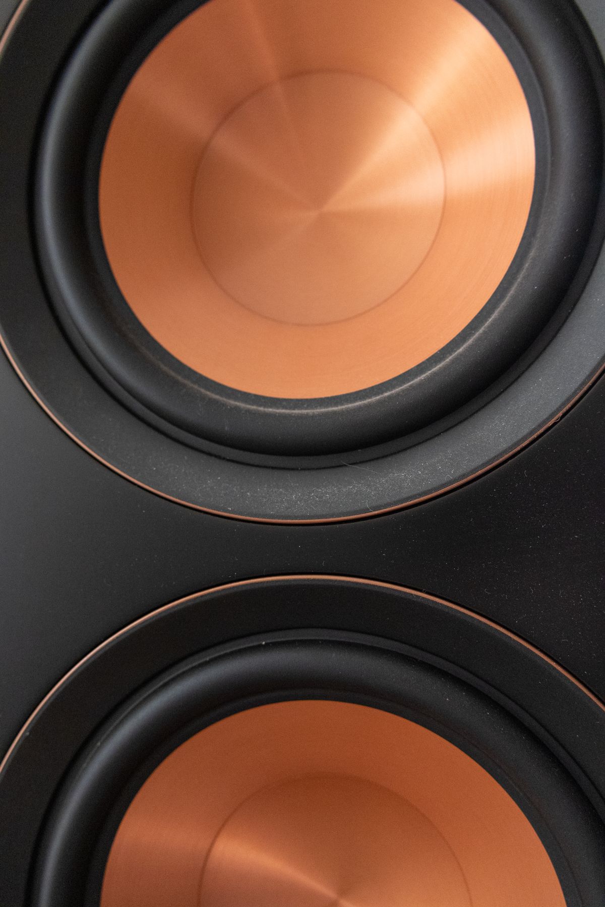 Close-up of copper speaker driver voice coil assembly illustrating thermal management and heat dissipation requirements for competition car audio