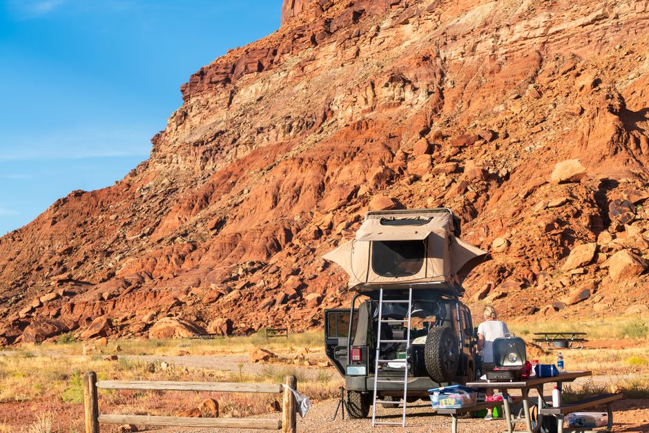 Overlanding vehicles parked at a scenic overlook, symbolizing the journey and community fostered by the military-to-overland movement