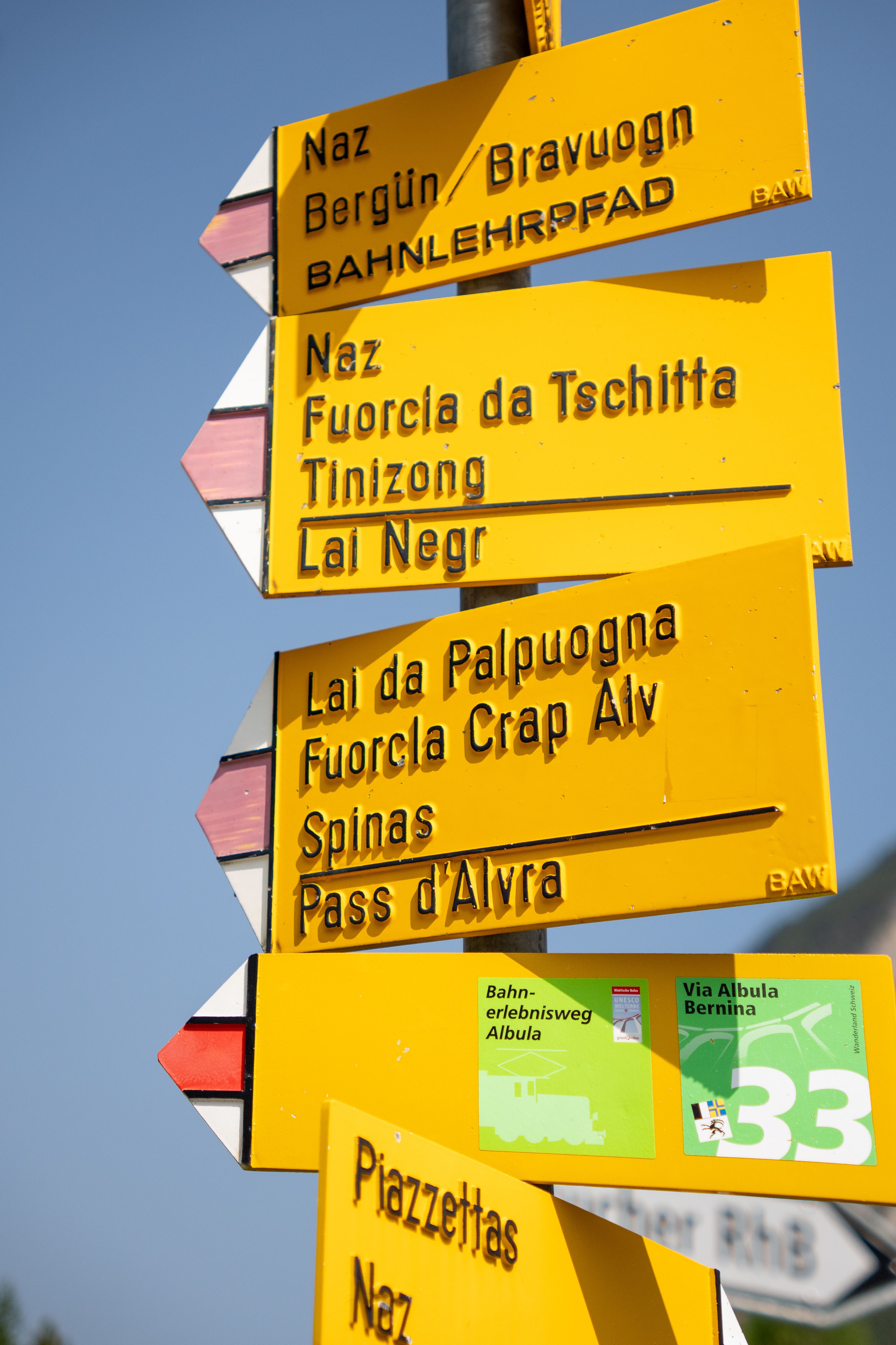 Yellow Hiking Trail Signs in Swiss Alps · Free Stock Photo