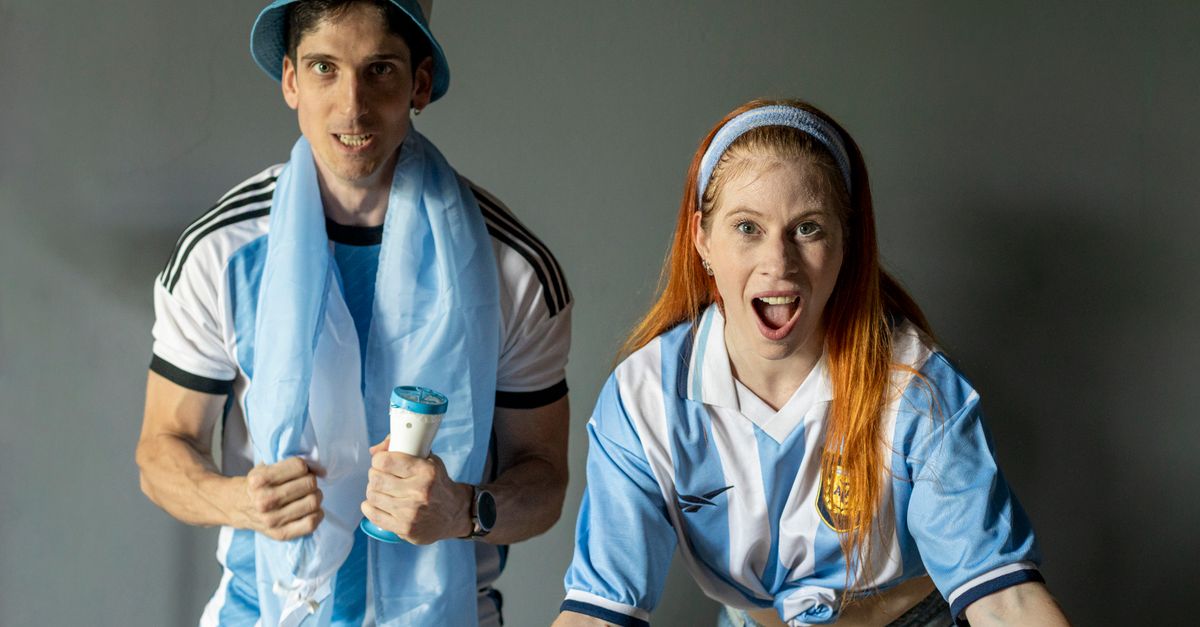 Rosalía faces boycott calls in Argentina after 2026 World Cup final video repost Two excited fans in Argentina jerseys express joy and support indoors.