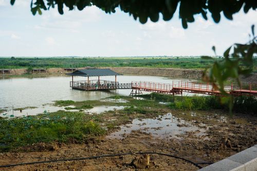 Free Tranquil gazebo by a riverside in Cambodia, perfect for relaxing and enjoying nature's serenity. Stock Photo